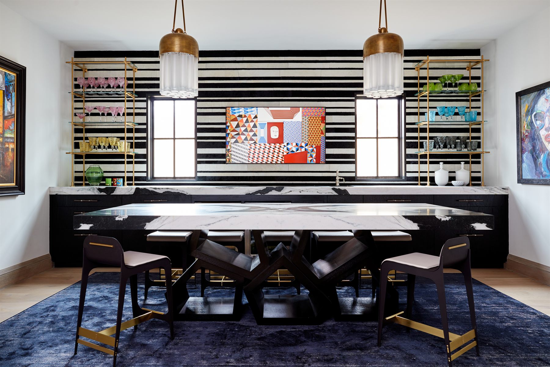 Wet bar with horizontal stripe wallpaper and brass shelving