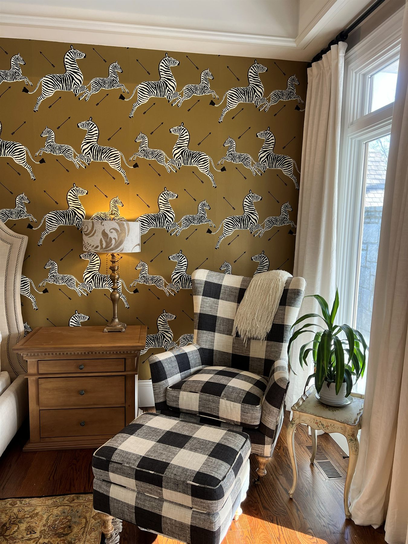 Sitting area with Scalamandré zebra wallpaper and gingham chair